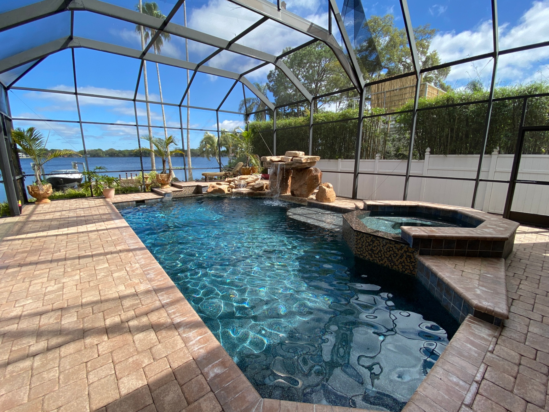 After: Fully remodeled pool with new finish, tile, and water feature in Tampa Bay